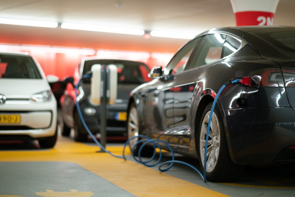 Electric Car charges at a gas station